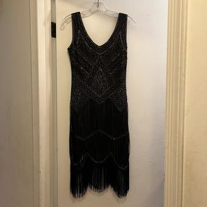 Flapper style, beaded fringe dresses.